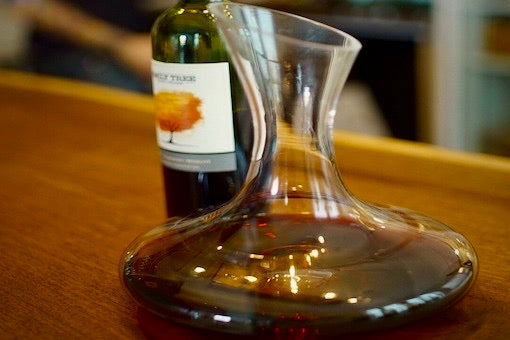 Decanting Wine as a Subtle Art of Pouring from Nothing into Nowhere